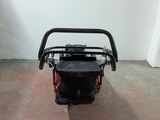 an image of a small motorcycle parked in a garage