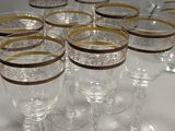 a lot of wine glasses sitting on a table