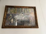 une image d'un tableau accroché au mur d'une pièce