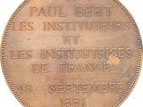 a close up of a bronze coin with the words paul bert les instituteurs