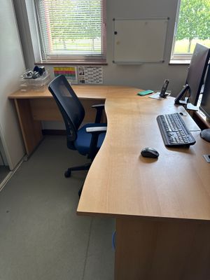 a desk with a computer and a keyboard on it