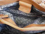 the inside of a handbag with a zipper on the inside
