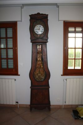 a grandfather clock in the corner of a room