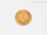 an image of a gold coin sitting on top of a white surface