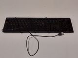 a black keyboard with a black cord attached to it