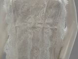 an image of a mannequin wearing a white dress with lace on it