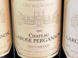 several bottles of wine are lined up on a table