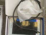 a box with a tablet in it sitting on the floor