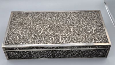 a silver box with a handle and a handle on top of it
