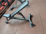 a gym bench and dumb dumbs in a gym