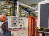 a man that is working on a machine in a factory
