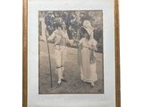 an old picture of a couple of people standing next to each other