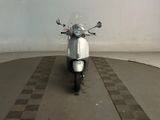 a motor scooter that is parked in a garage