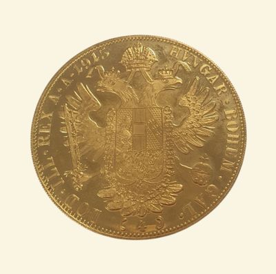 une vieille pièce d'or sur laquelle figure un aigle à deux têtes