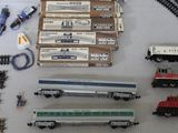 a lot of toy trains on the table together