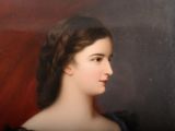 portrait of a woman in a black dress with a red background