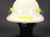 a white hard hat with yellow tape on it