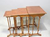 three wooden tables sitting on top of each other on a white surface