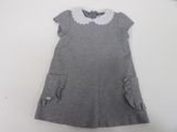 grey dress with white collar and pockets on a hanger