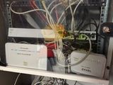 a rack with a lot of wires and other electronics in it