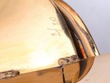 a close up of a gold clock on a table