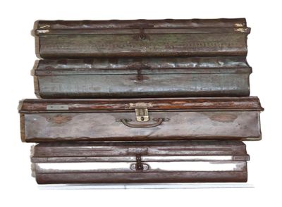 several pieces of luggage stacked on top of each other on a white surface