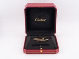 an image of a red box with a gold bracelet inside of it