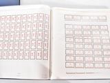 an open book with a keyboard in it on a table
