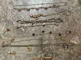 a lot of necklaces that are on the table