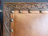 a picture of a brown leather chair with a picture frame