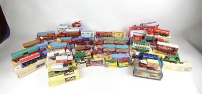 many different types of toy trains and trucks on the table