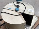 a white object sitting on a pallet next to a blue object