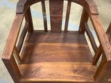 a wooden chair that is sitting on the floor