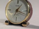 a small clock that is sitting on a table