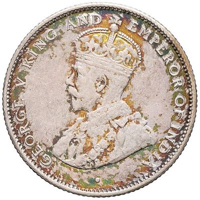 a close up of a coin with a crown on it