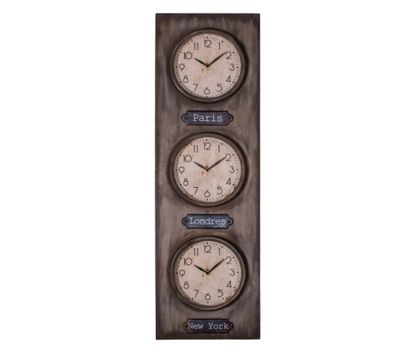 three clocks mounted on a wall with a chalk board underneath them