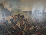 un tableau représentant un homme à cheval au milieu d'une bataille