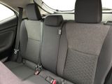 two seats in the back of a car that are grey