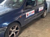 a blue car that is parked in a garage