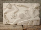 a white sculpture of a man and a woman on a bench