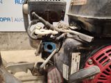 a close up of a motor bike with a chain attached to it