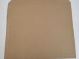 a piece of brown cardboard sitting on top of a white table