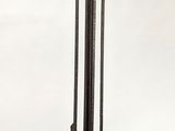 a bird feeder hanging from a metal pole with a bird on it