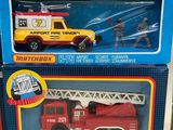 three toy firetrucks that are in the box