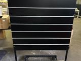 a black and white chest of drawers in a warehouse