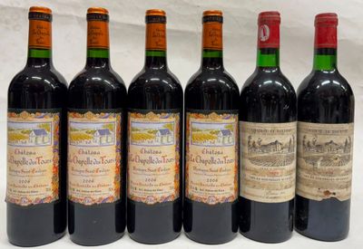 six bouteilles de vin sont alignées sur une table