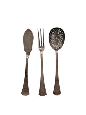 three forks and a spoon on a white background
