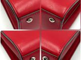 four different angles of a red purse with a metal clasp