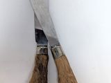 une paire de ciseaux munis de griffes