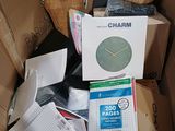 a cardboard box with a clock inside of it